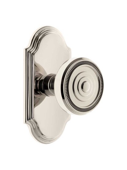 Grandeur Arc Rosette Door Set with Soleil Knobs in Polished Nickel.